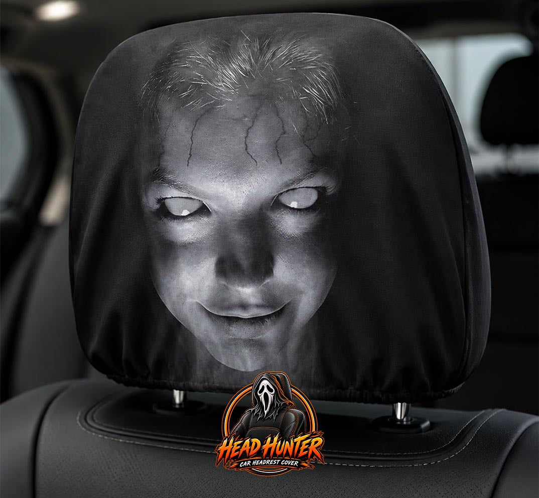 Scary face headrest cover seen close up through the car window